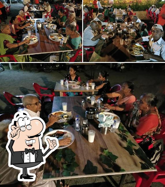 Take a seat at one of the tables at Punjabi.com Rajkot