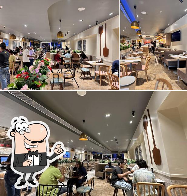 The interior of Si Nonna's - The Original Sourdough Pizza IBC Piplod Surat