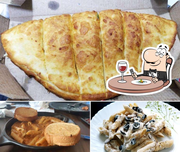 Food at Cheesiano Pizza Baner