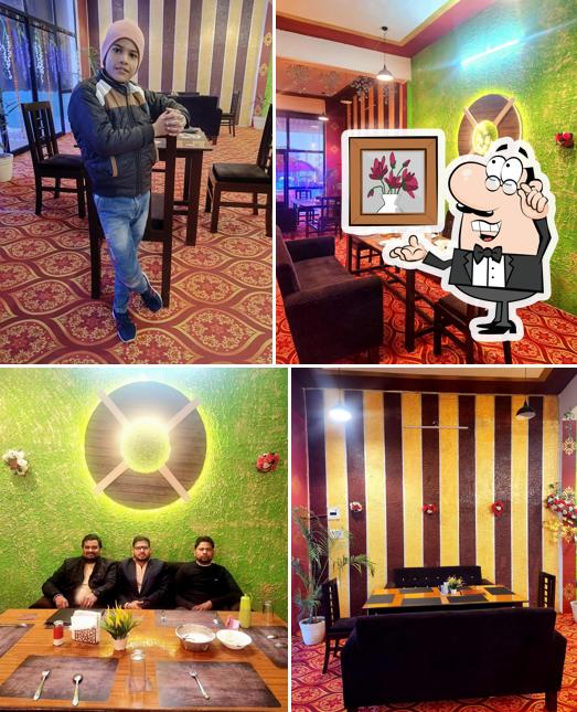 Take a seat at one of the tables at MADHURAM MULTI CUISINE FAMILY RESTAURANT