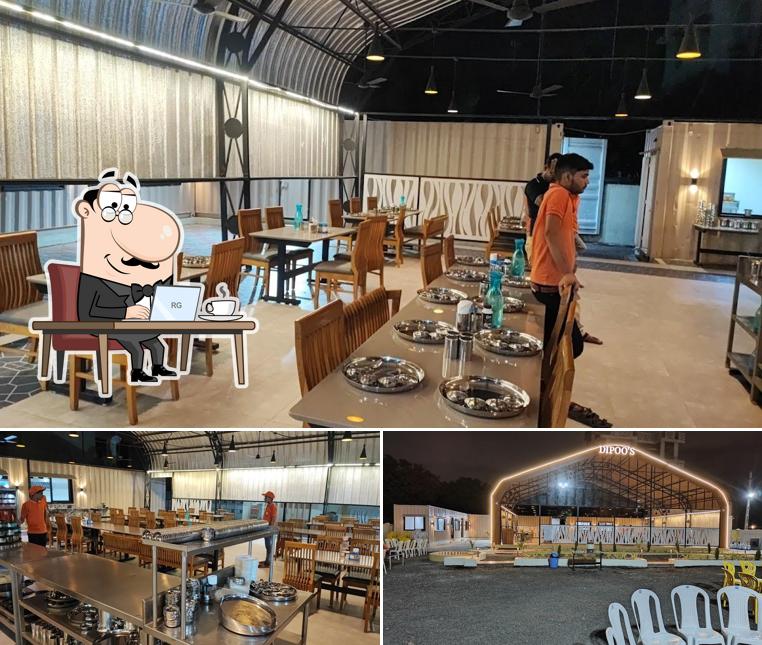 Take a seat at one of the tables at DIPOO'S Restro & Cafe