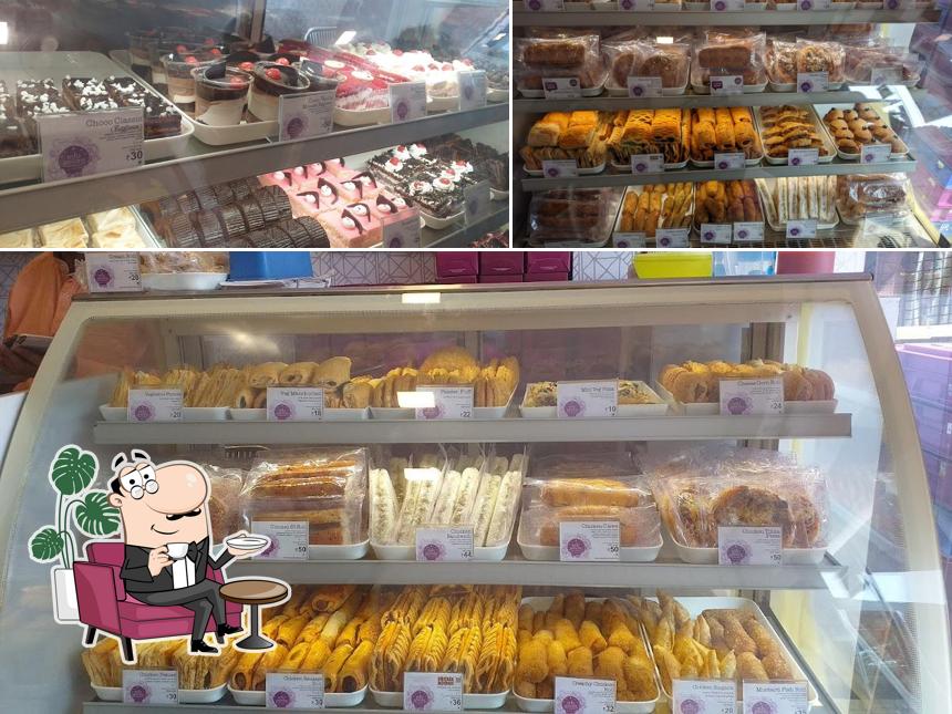 Take a seat at one of the tables at Mio Amore - The Cake Shop (Basirhat City)