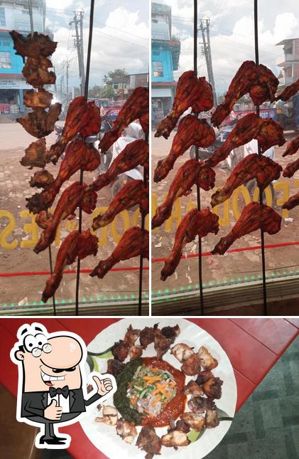 Look at the picture of CROSSROAD CAFE. FASTFOOD CUM RESTAURANT