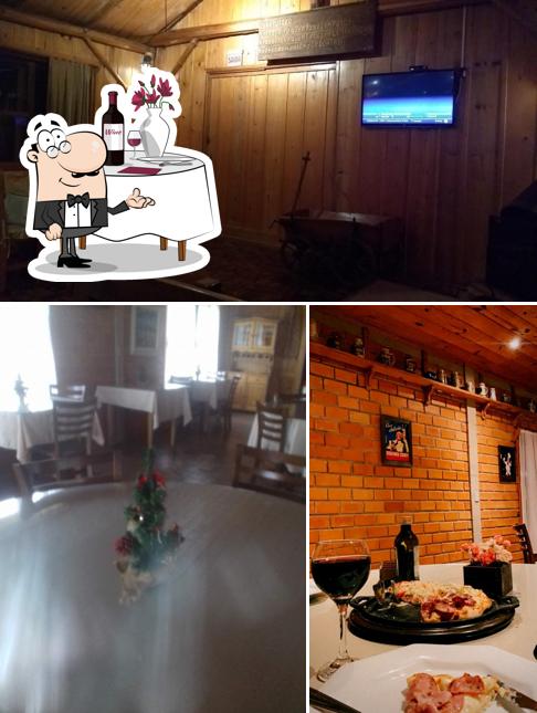 A imagem a Master Pizzaria’s mesa de jantar e interior