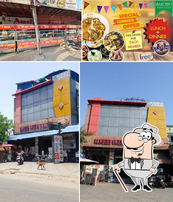 The exterior of Sandeep Sweets Bakers and Veg Restaurent -Sweet Shop/Family Restaurant/Home Delivery/Kitty Party/Catering/Best Baker in Tanda