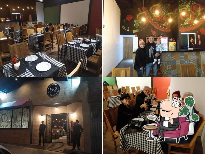 Sente em uma das mesas no Di Marcelo Cecconi | Levare Pizzaria em Campos do Jordão