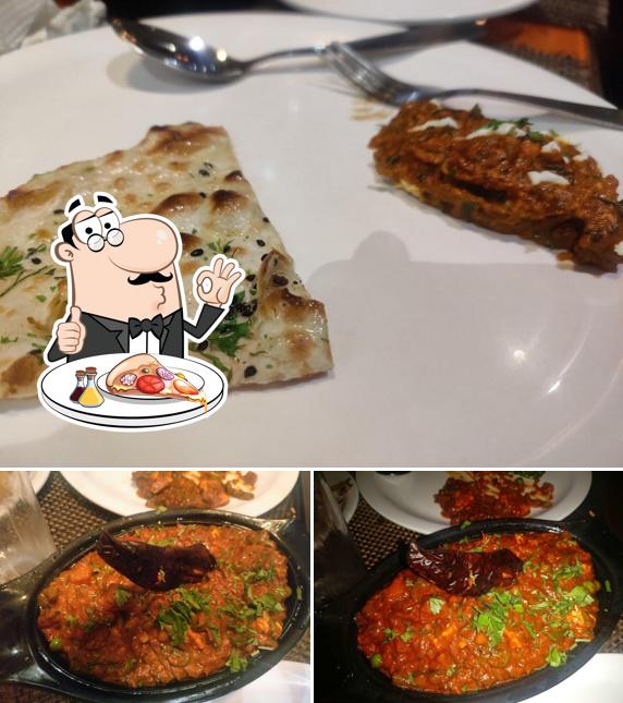 Order pizza at Tamarind Spice Restaurant and Bar