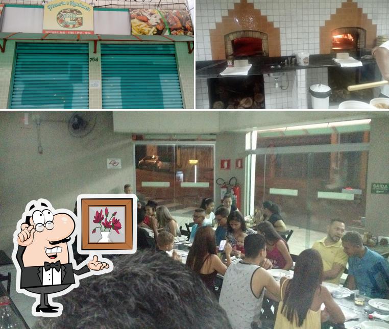 Sente em uma das mesas no Pizzaria e Lanchonete TUTTI
