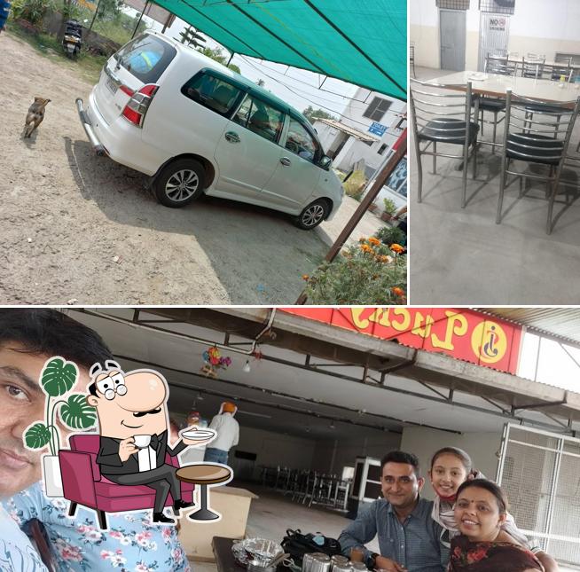 Take a seat at one of the tables at JS Lucky Tourist Dhaba