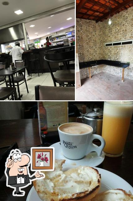 Confira a foto apresentando interior e mesa de jantar no Padaria Vinho's