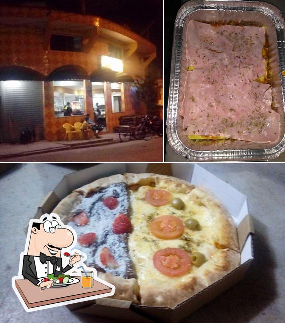 A imagem da comida e interior no Pizzaria Sol Nascente