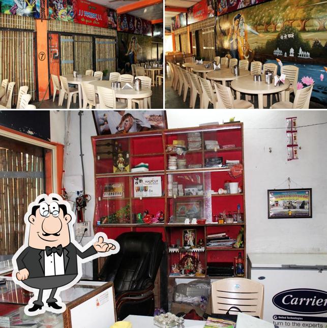 Take a seat at one of the tables at Krishna Prasadam Restaurant