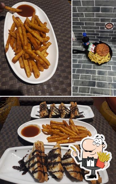 Order fries at Chocolate Lovers Cakes & Cafe