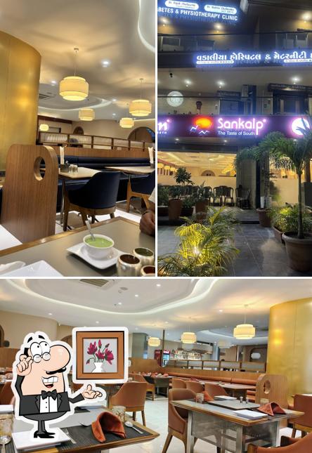 Take a seat at one of the tables at Sankalp Saffron & Sam's Pizza Quick Pick