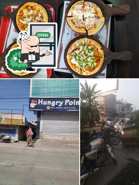 The picture of exterior and pizza at Hungry Point - Roorkee