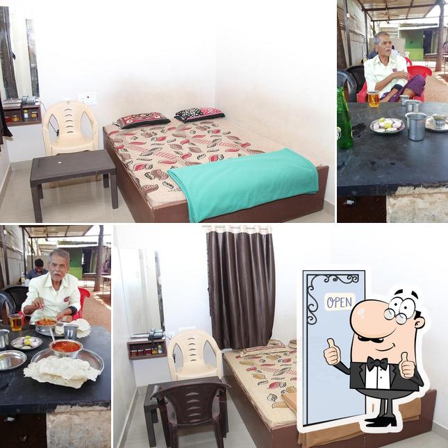 Look at the pic of SURABHI LODGE AND RESTAURANT KAMPLI