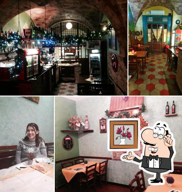 Dai un'occhiata agli interni di Pizzeria Stuzzicheria Rosso di sera