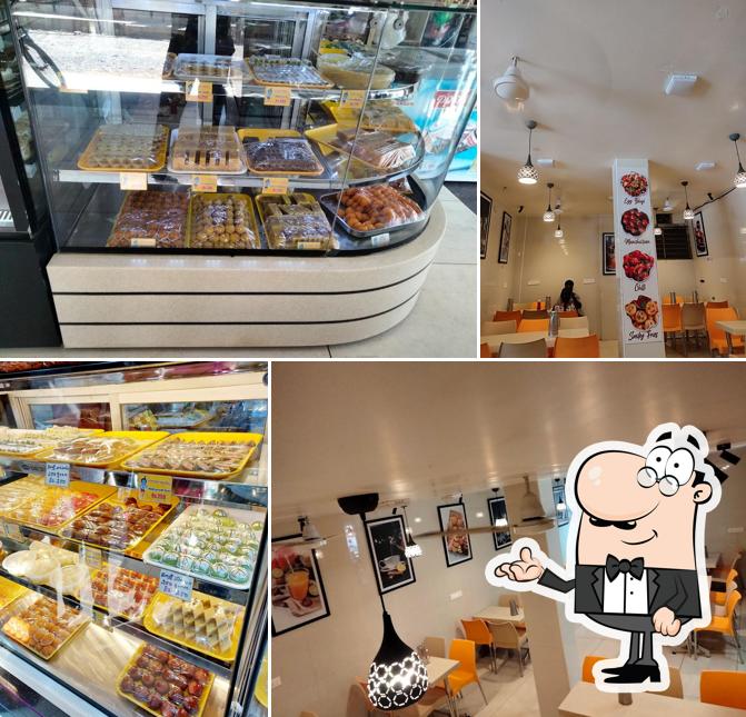 Take a seat at one of the tables at Shree Krishna Sweets and bakes