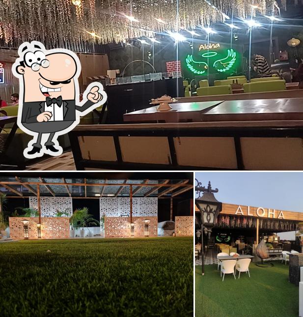 Take a seat at one of the tables at Aloha - The Rooftop Restaurant