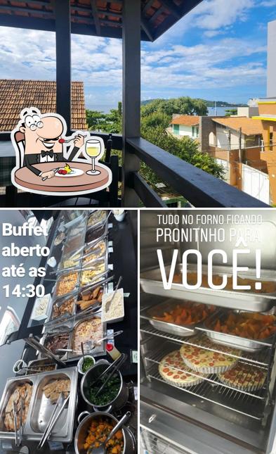 Dê uma olhada a foto mostrando comida e interior a Restaurante Di Maria