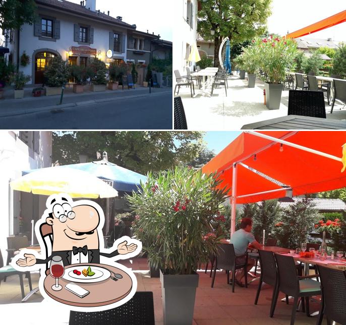 La foto di tavolo da pranzo e esterno da Café de la Poste
