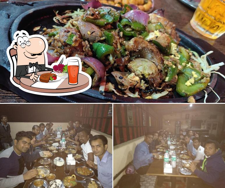 The image of Hill View Dhaba & Bar’s dining table and food