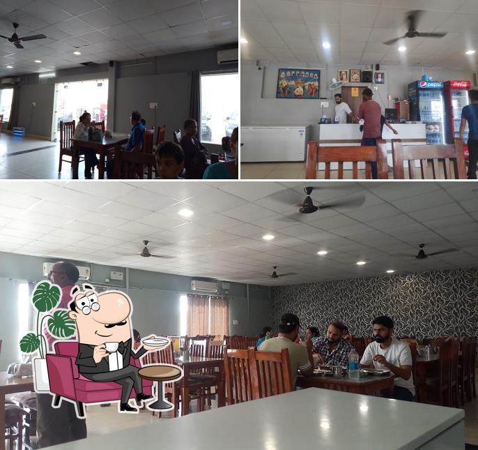 Take a seat at one of the tables at DHILLON PUNJABI DHABA