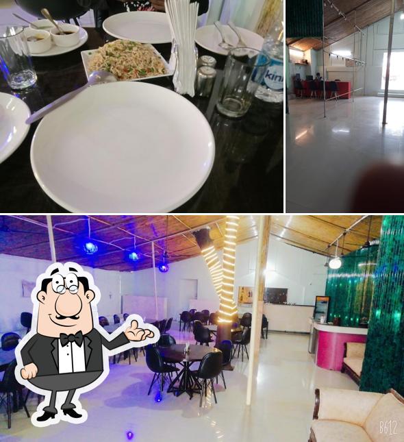 Take a seat at one of the tables at Parag milk parlour & Restaurant party lown