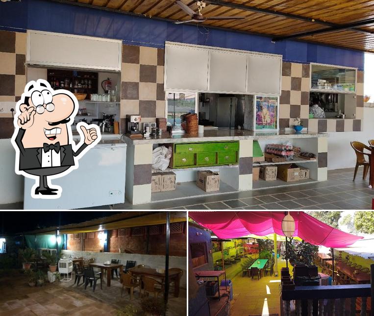 Take a seat at one of the tables at A Blue Star Garden Restaurant and Home Stay