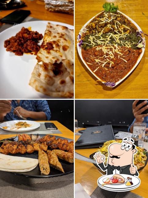 Get pizza at The G.O.A.T Restaurant