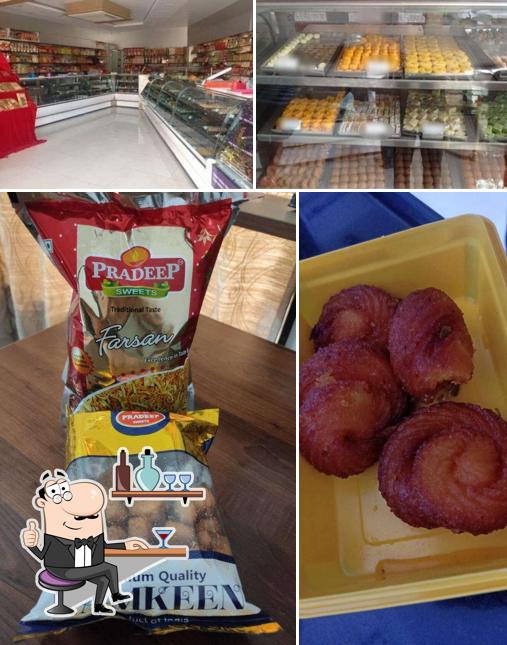 Take a seat at one of the tables at Pradeep Sweets