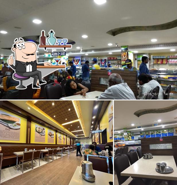 Take a seat at one of the tables at Adyar Ananda Bhavan - A2B