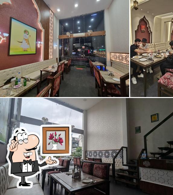 Take a seat at one of the tables at KARIM'S INDORE - ( ORIGINAL FROM JAMA MASJID DELHI-6 )