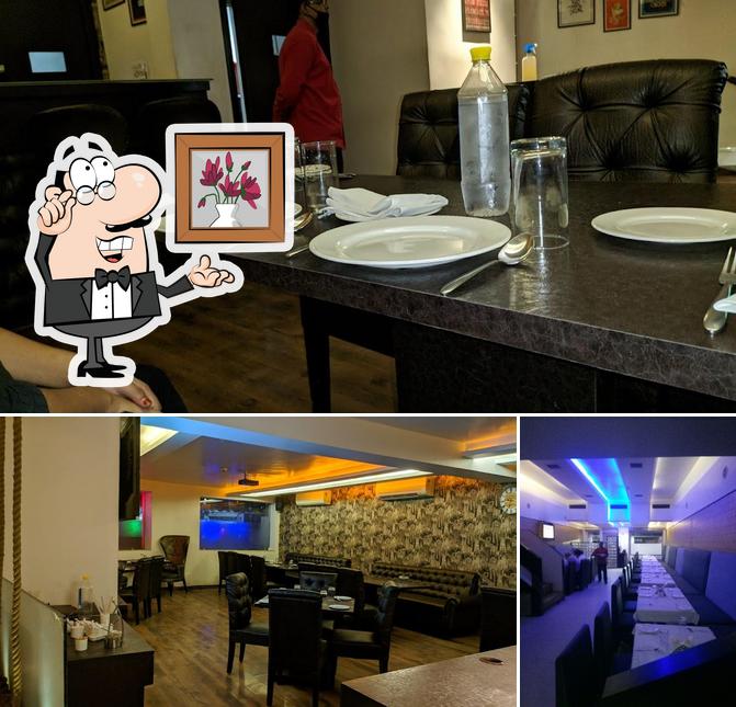 Take a seat at one of the tables at Kwality Restaurant