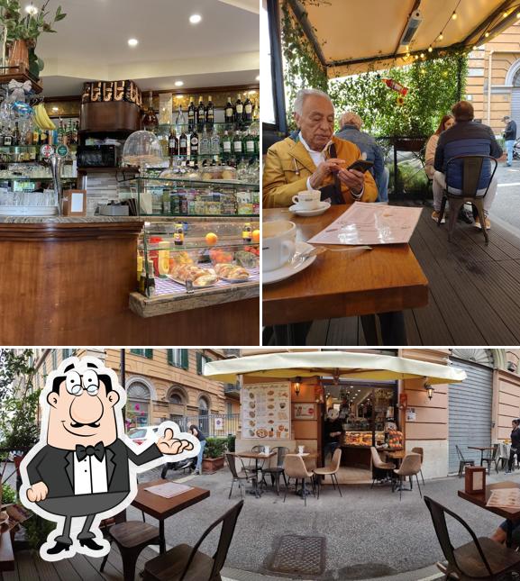 Guarda la foto che mostra la interni e tavolo da pranzo di Caffe dei Papi