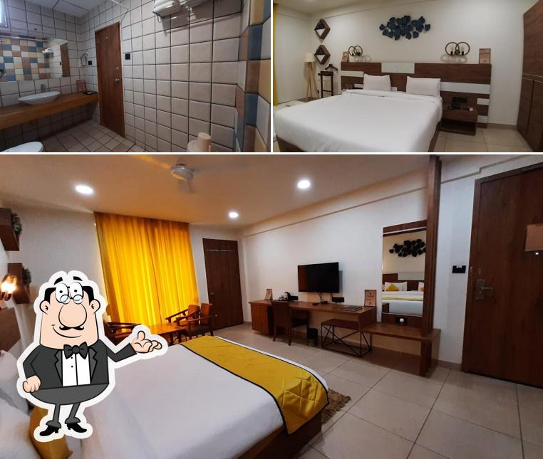 Take a seat at one of the tables at Phoenix Resort Best Destination Wedding Venue, Top Banquet Hall, Restaurant in Rajkot