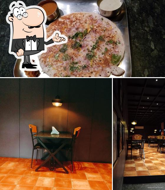 Check out the image depicting interior and food at Swad SitStop