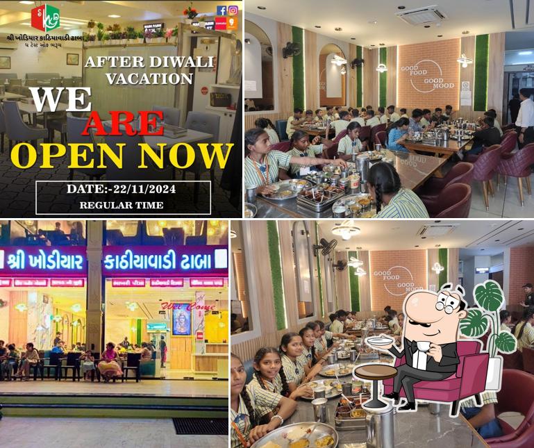 Take a seat at one of the tables at SHREE KHODIYAR KATHIYAWADI DHABA
