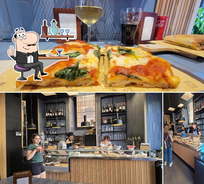 Guarda la foto che mostra la interni e pizza di La Ripiena