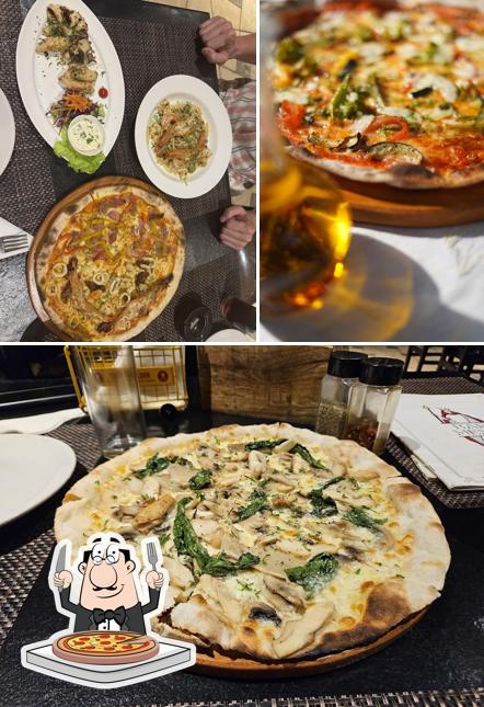 Pick pizza at WISE FOOL GOA