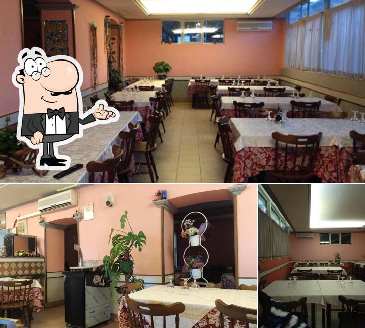 La immagine della interni e tavolo da pranzo di Il Cacciatore