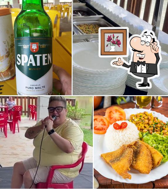 Sente em uma das mesas no Recanto Do Sol Pesca e Lazer