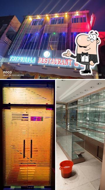 Take a seat at one of the tables at Tirumal Bar and Restaurant