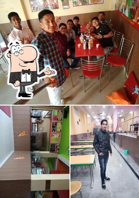 The image of Pizza Bite, Pithoragarh’s interior and dining table