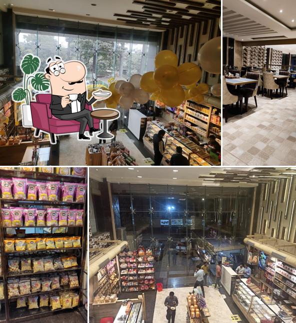 Take a seat at one of the tables at Rahul Sweets Panki Kanpur Restaurant in Panki