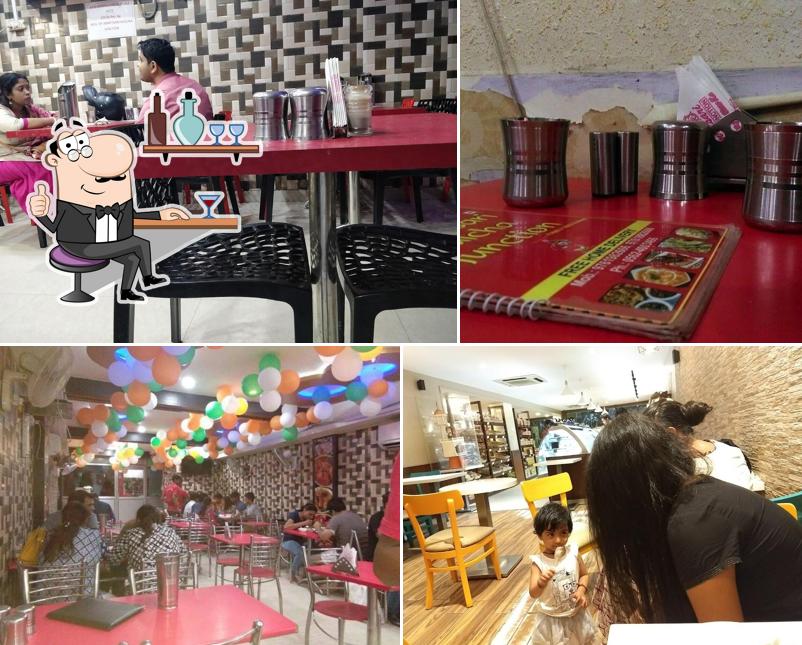 Take a seat at one of the tables at Amritsari Kulcha Junction