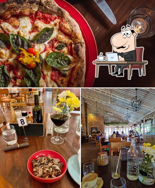 The photo of interior and pizza at Luna’s Ristorante Goa