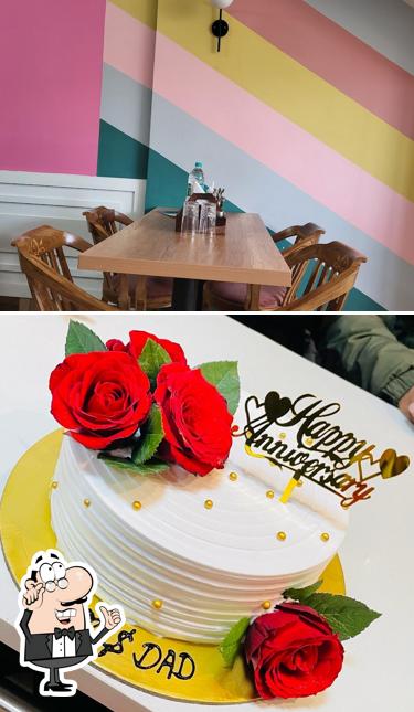 Take a seat at one of the tables at Cake's Villa - Best Restaurant and Bakery in Narwana