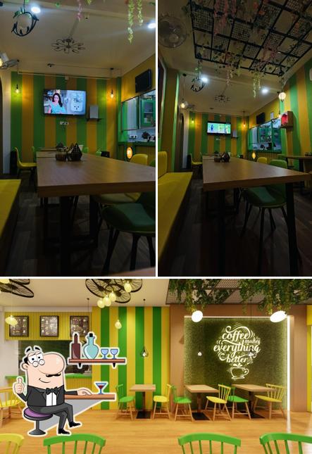 Take a seat at one of the tables at Cheesy Crazy Cafe- Best Cafe & Restraunt In Azamgarh
