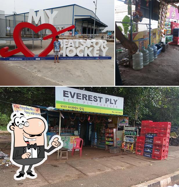 Take a seat at one of the tables at Lakeshwar Snacks And Variety Store